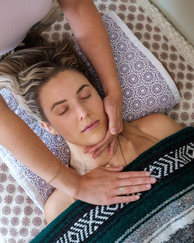 Patient receiving massage therapy at Holistic Alignment Strategies