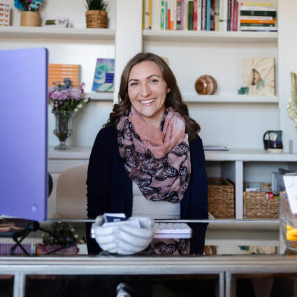 Dr. Vanessa Gale behind her desk at Holistic Alignment Strategies